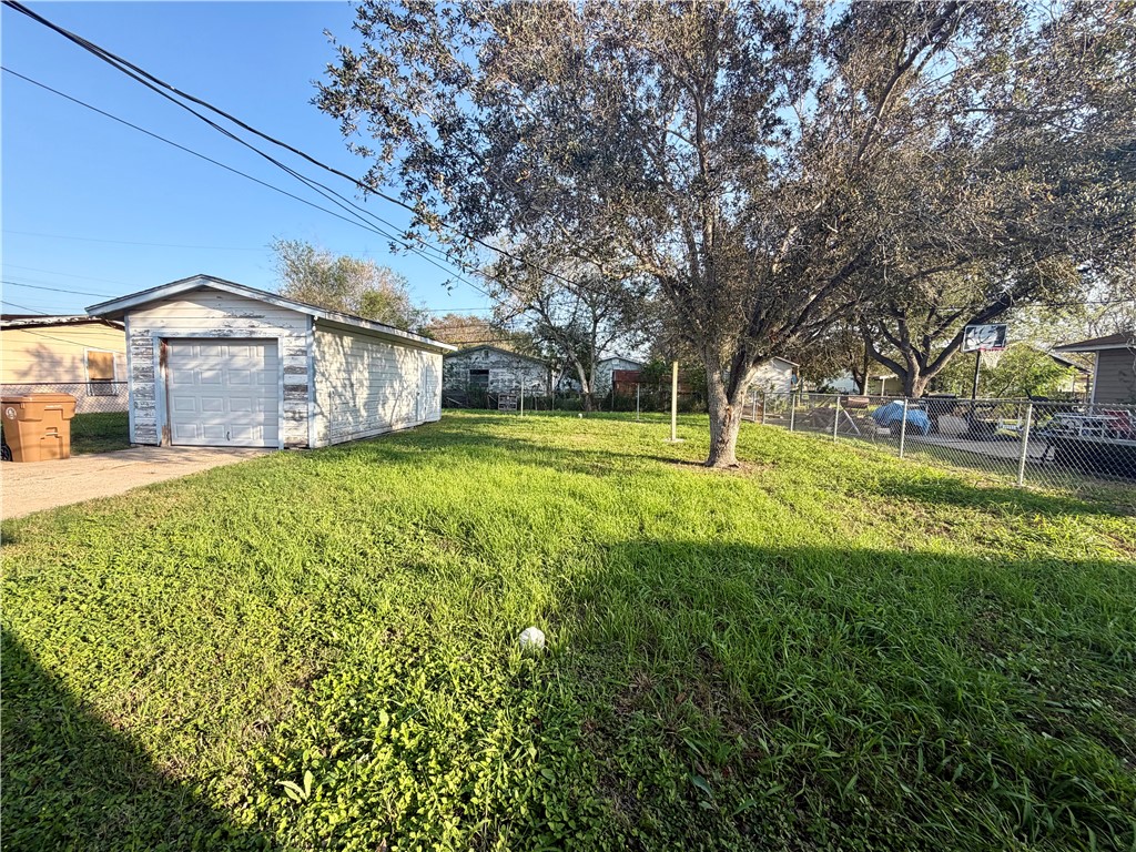 4914 Carroll Lane Corpus Christi, TX 78415 - Photo 10 of 10 a view of a house with a big yard and large tree