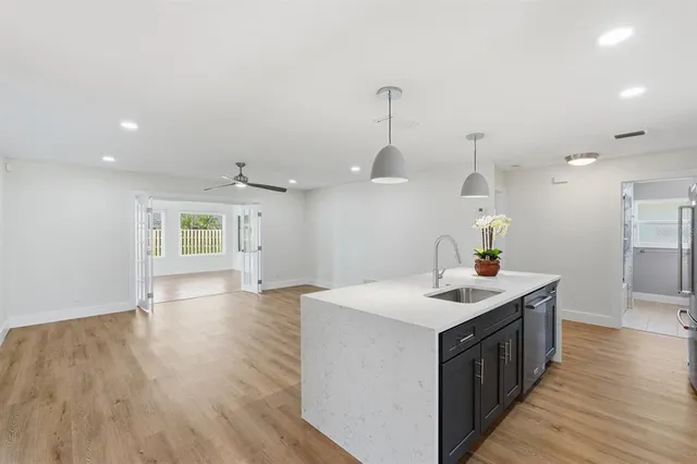 a view of a room with wooden floor and window