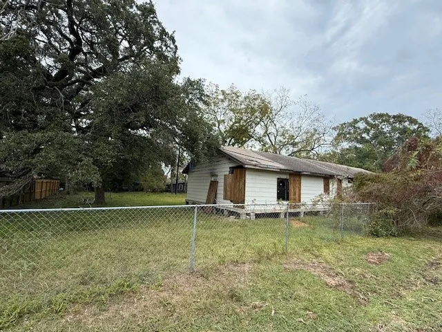 a house with trees in the background