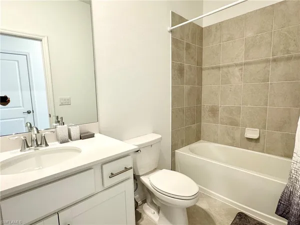 a bathroom with a sink a toilet and a bathtub