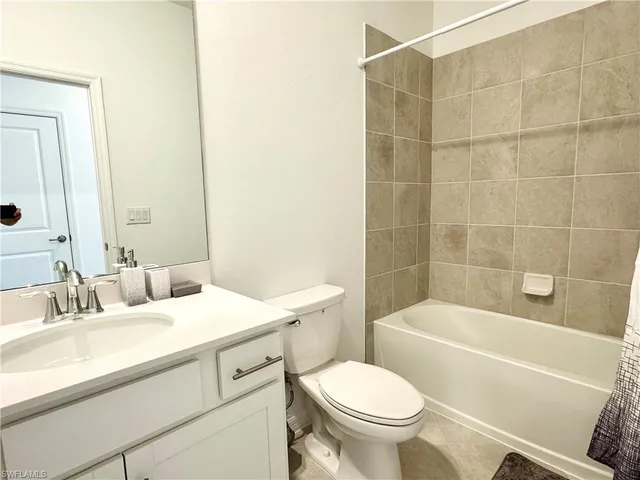 a bathroom with a sink a toilet and a bathtub