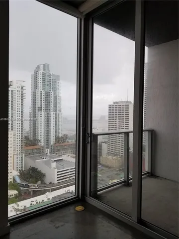 a room with water heater and a wooden floors