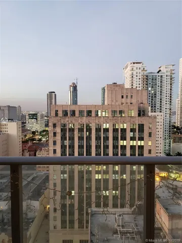 a kitchen that has a sink stainless steel appliances a counter space and a window