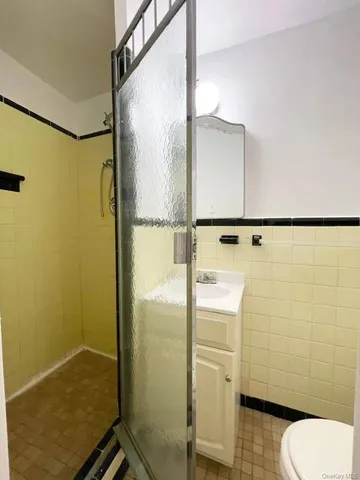 a view of a brick building next to a yard