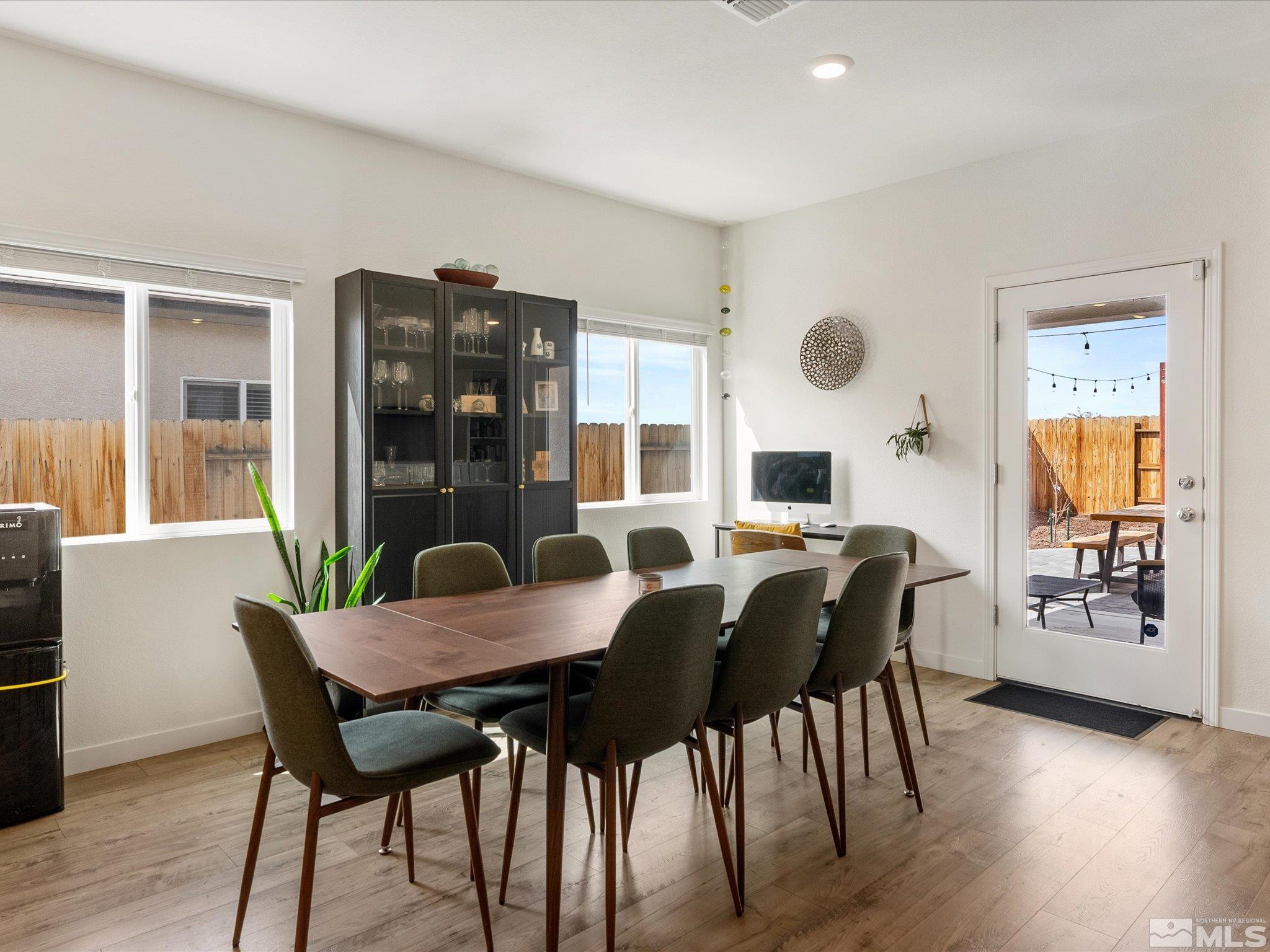 1173 Alder Drive Fallon, NV 89406 - Photo 11 of 40 a view of a dining room with furniture and wooden floor