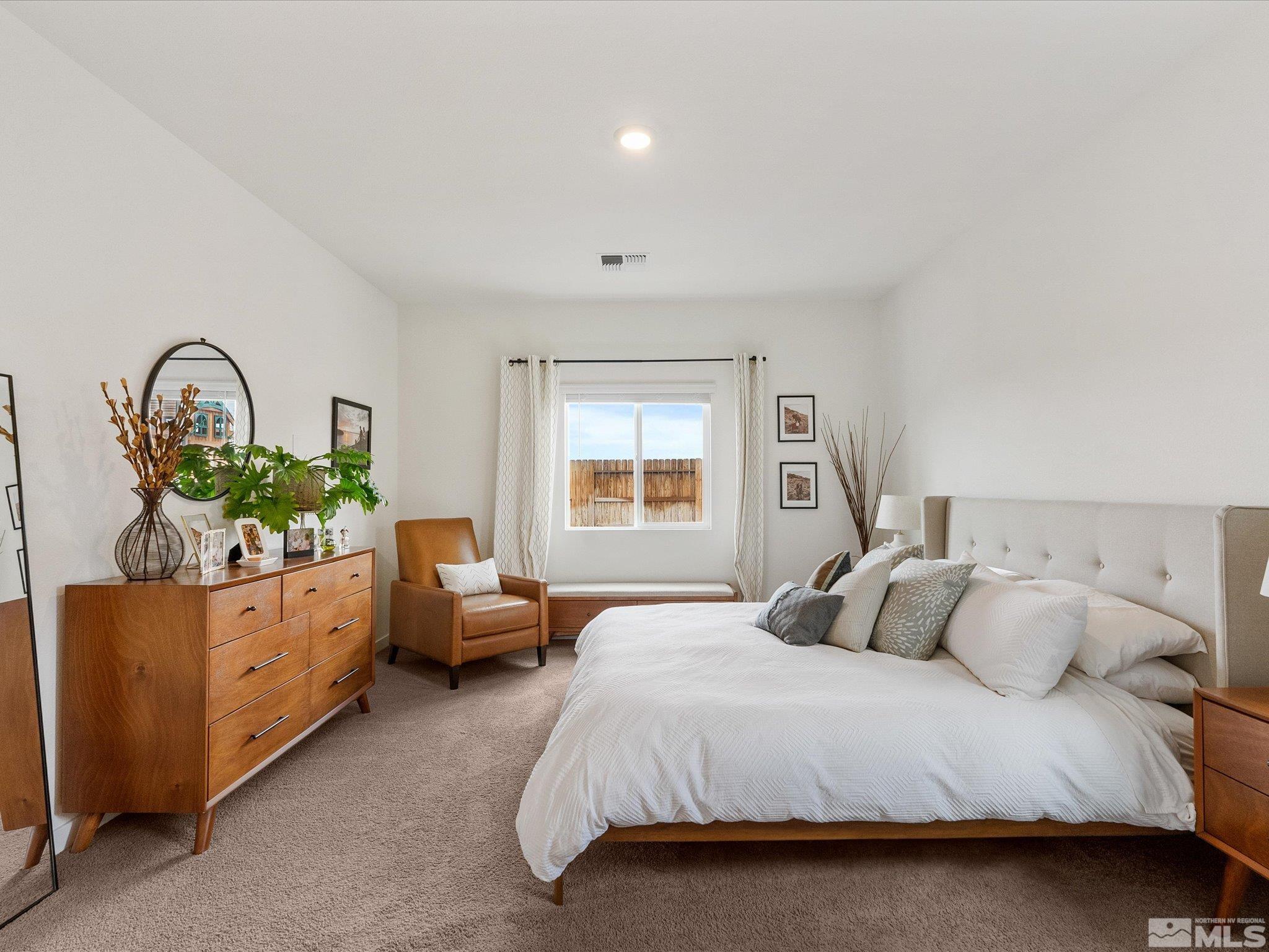 1173 Alder Drive Fallon, NV 89406 - Photo 17 of 40 a bedroom with a bed and window