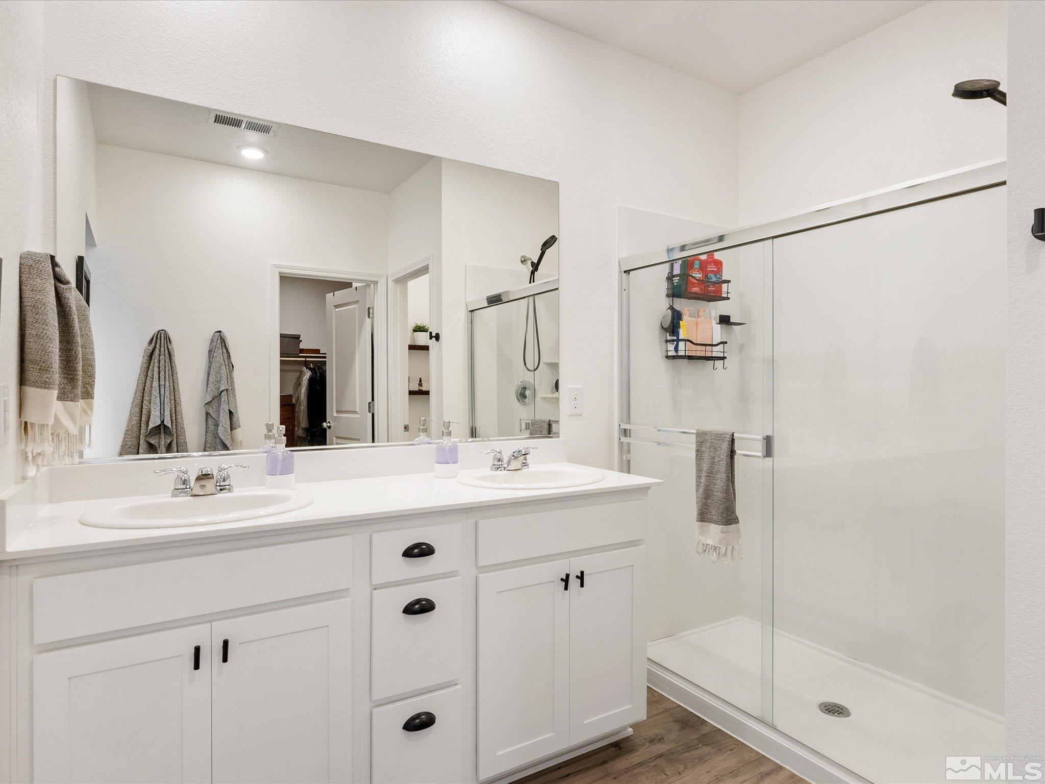 1173 Alder Drive Fallon, NV 89406 - Photo 19 of 40 a bathroom with a double vanity sink mirror double and shower