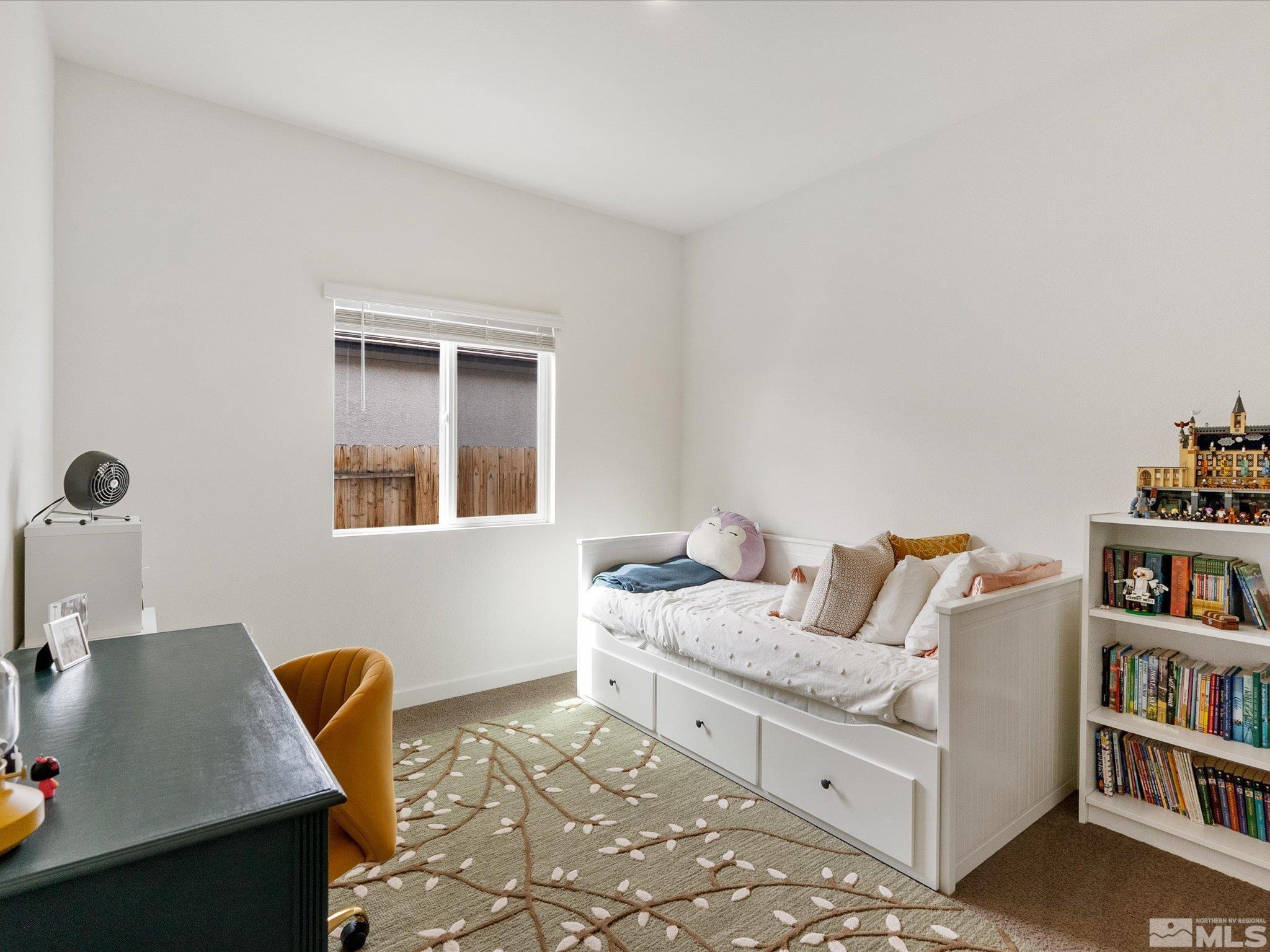 1173 Alder Drive Fallon, NV 89406 - Photo 26 of 40 a living room with furniture and book shelf