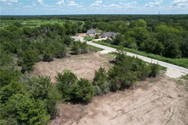 an aerial view of residential house with outdoor space