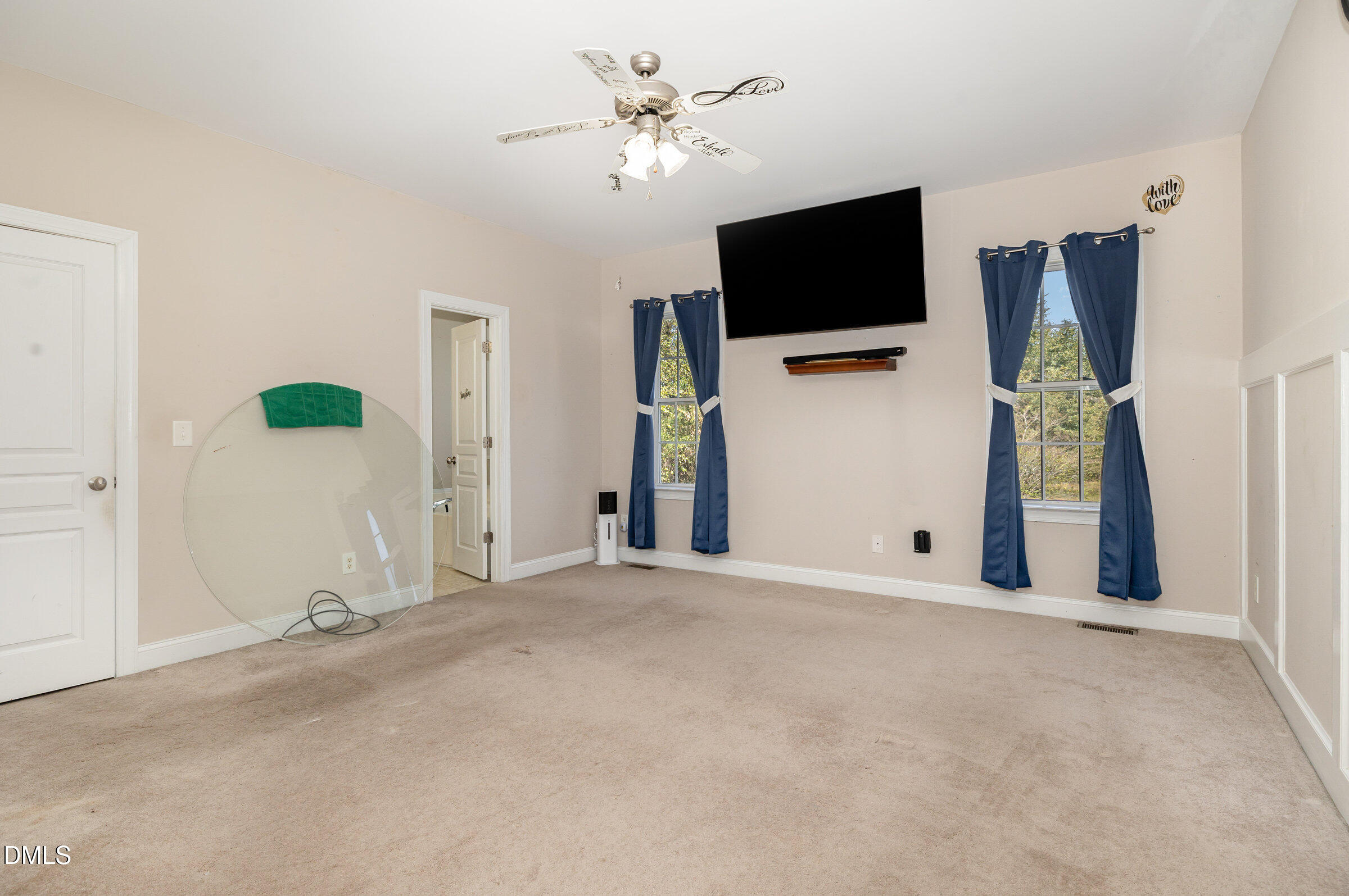 7300 Singlepond Lane Willow Spring, NC 27592 - Photo 15 of 34 a view of a livingroom with a flat screen tv