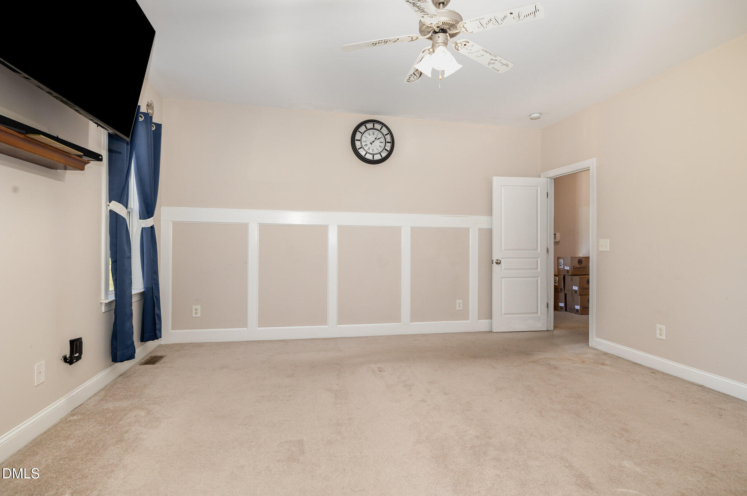 7300 Singlepond Lane Willow Spring, NC 27592 - Photo 16 of 34 a view of an empty room with wooden floor and windows