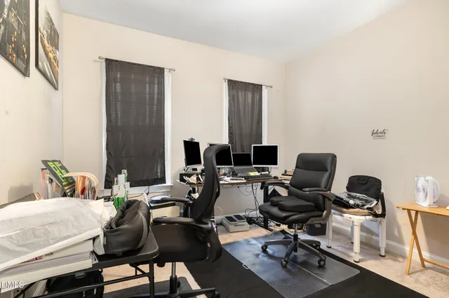 a bedroom with a bed and a mirror