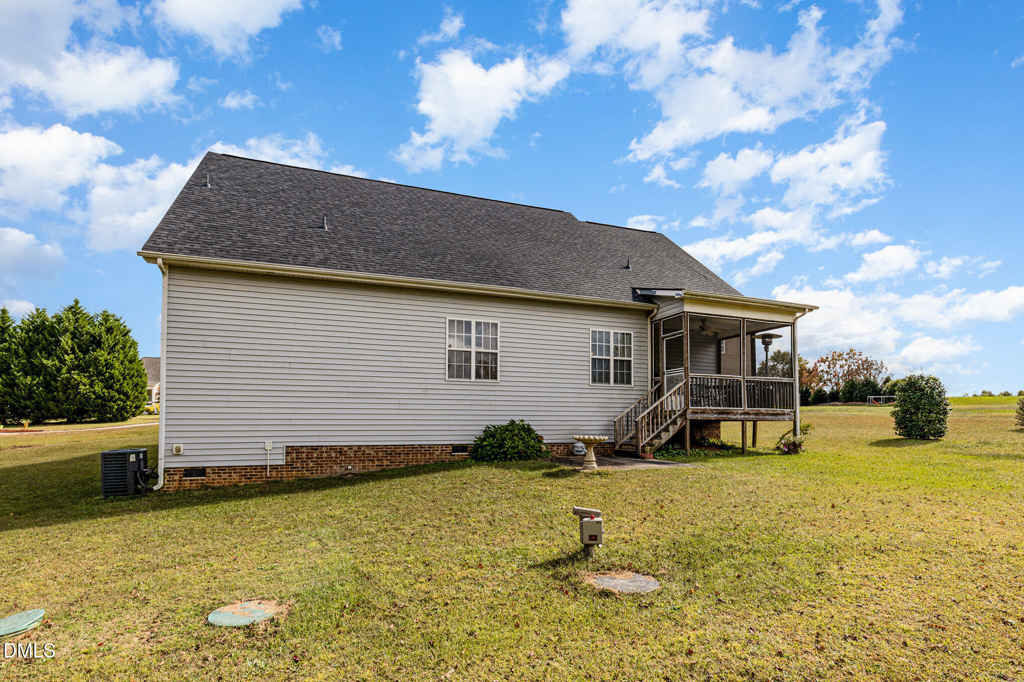 7300 Singlepond Lane Willow Spring, NC 27592 - Photo 24 of 34 a view of a house with a yard