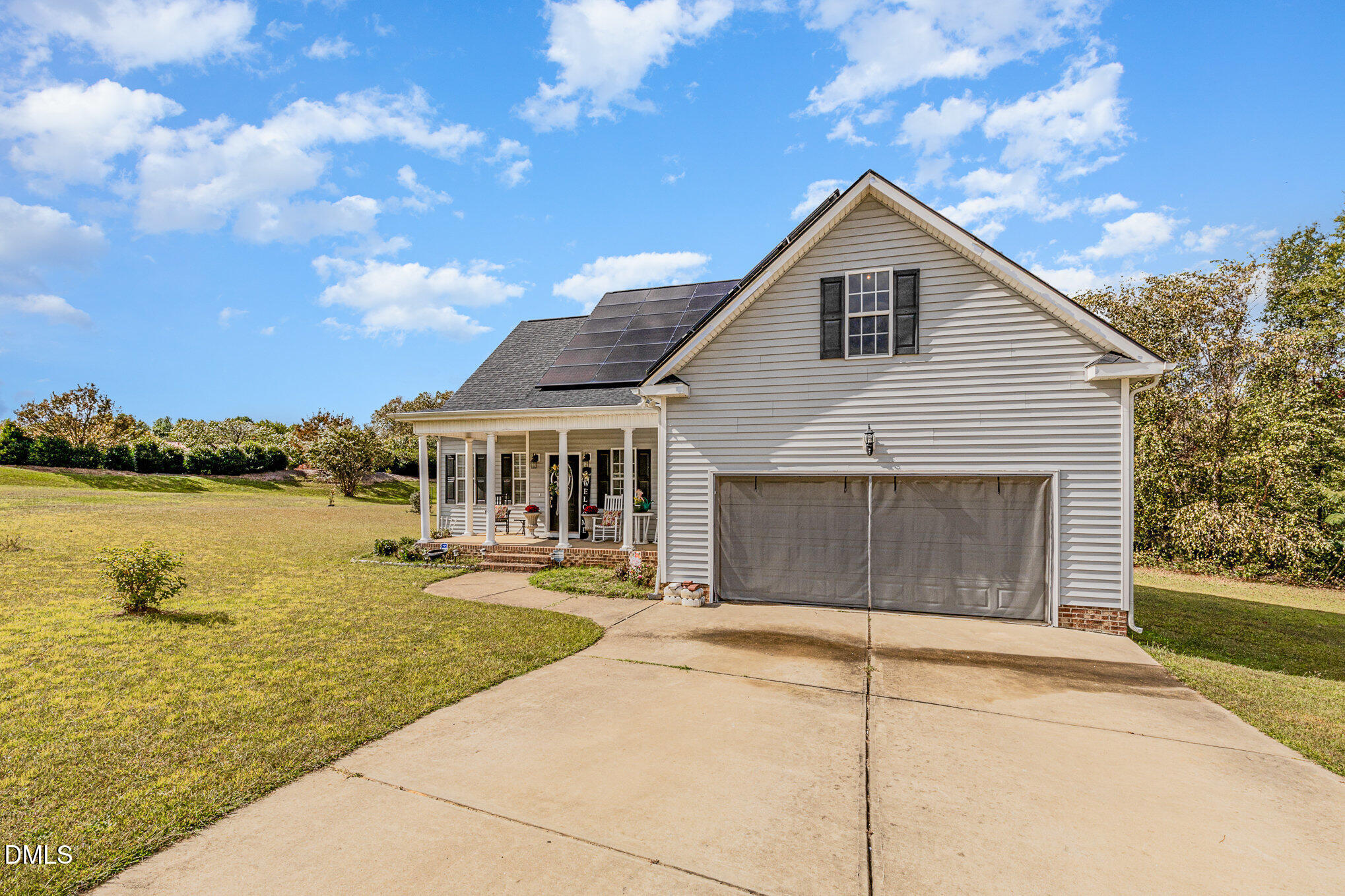 7300 Singlepond Lane Willow Spring, NC 27592 - Photo 2 of 34 a front view of a house with a yard