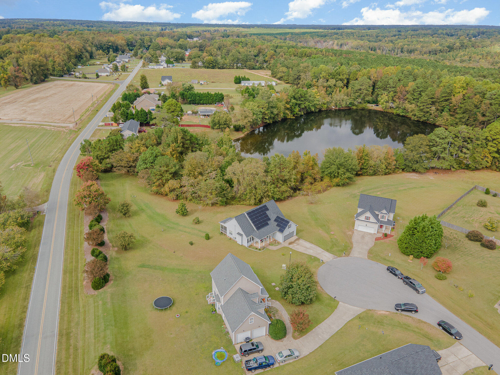 7300 Singlepond Lane Willow Spring, NC 27592 - Photo 30 of 34 an aerial view of a house with a lake view