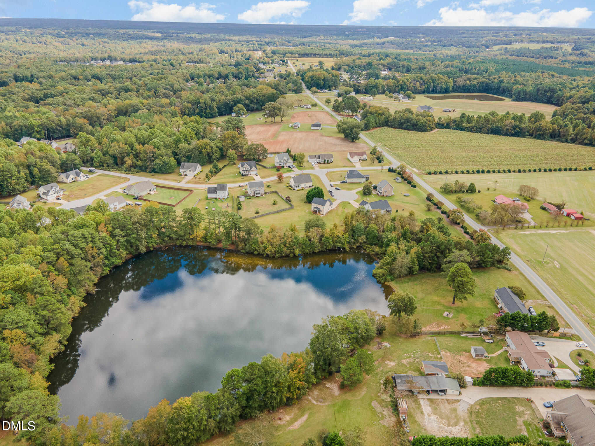 7300 Singlepond Lane Willow Spring, NC 27592 - Photo 32 of 34 an aerial view of residential houses with outdoor space and river