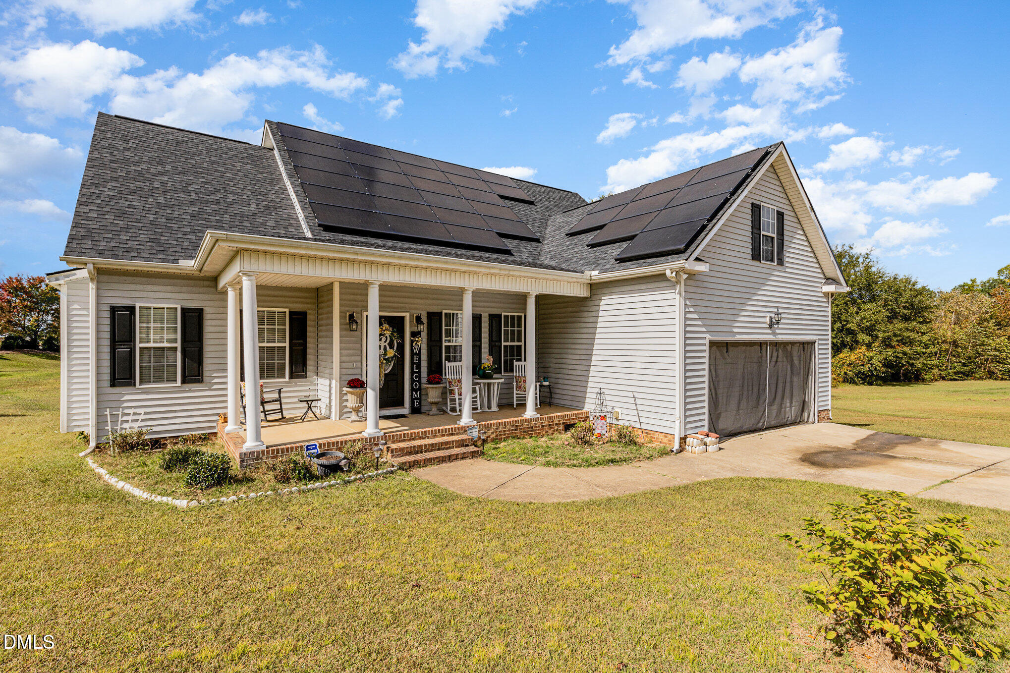 7300 Singlepond Lane Willow Spring, NC 27592 - Photo 3 of 34 a front view of a house with a yard outdoor seating and barbeque oven