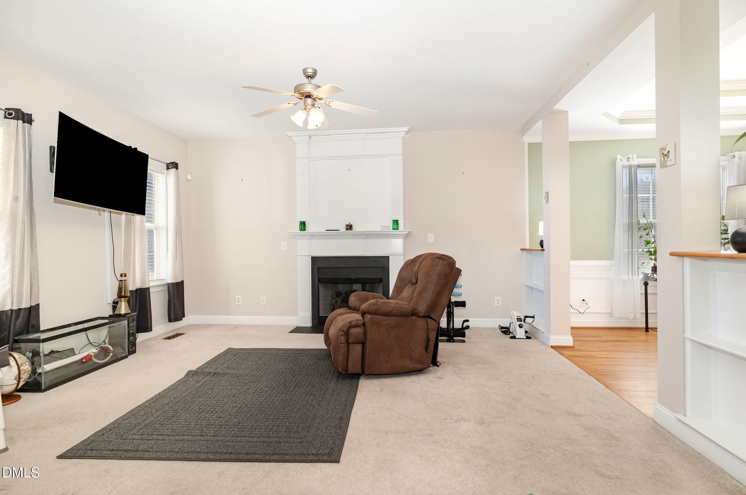 7300 Singlepond Lane Willow Spring, NC 27592 - Photo 8 of 34 a living room with furniture and a flat screen tv