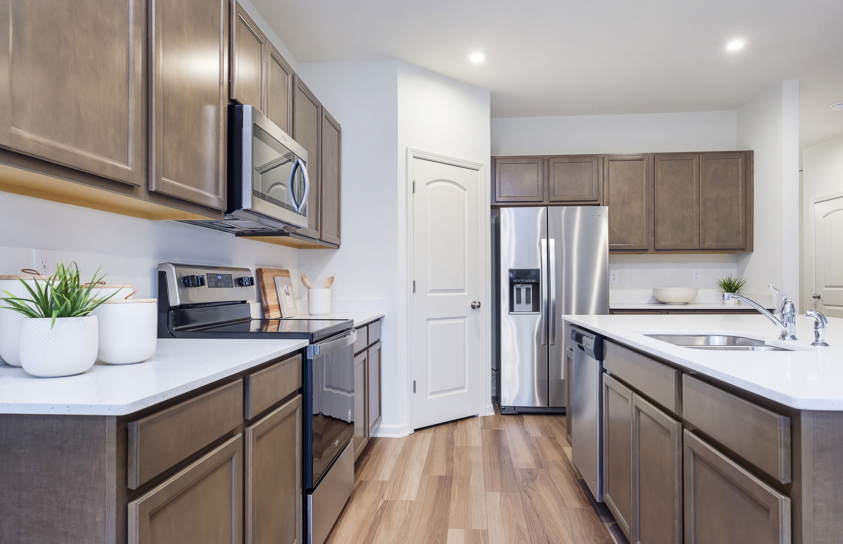 966 Houston Street Batavia, IL 60510 - Photo 5 of 20 a kitchen with stainless steel appliances granite countertop a sink a stove and refrigerator