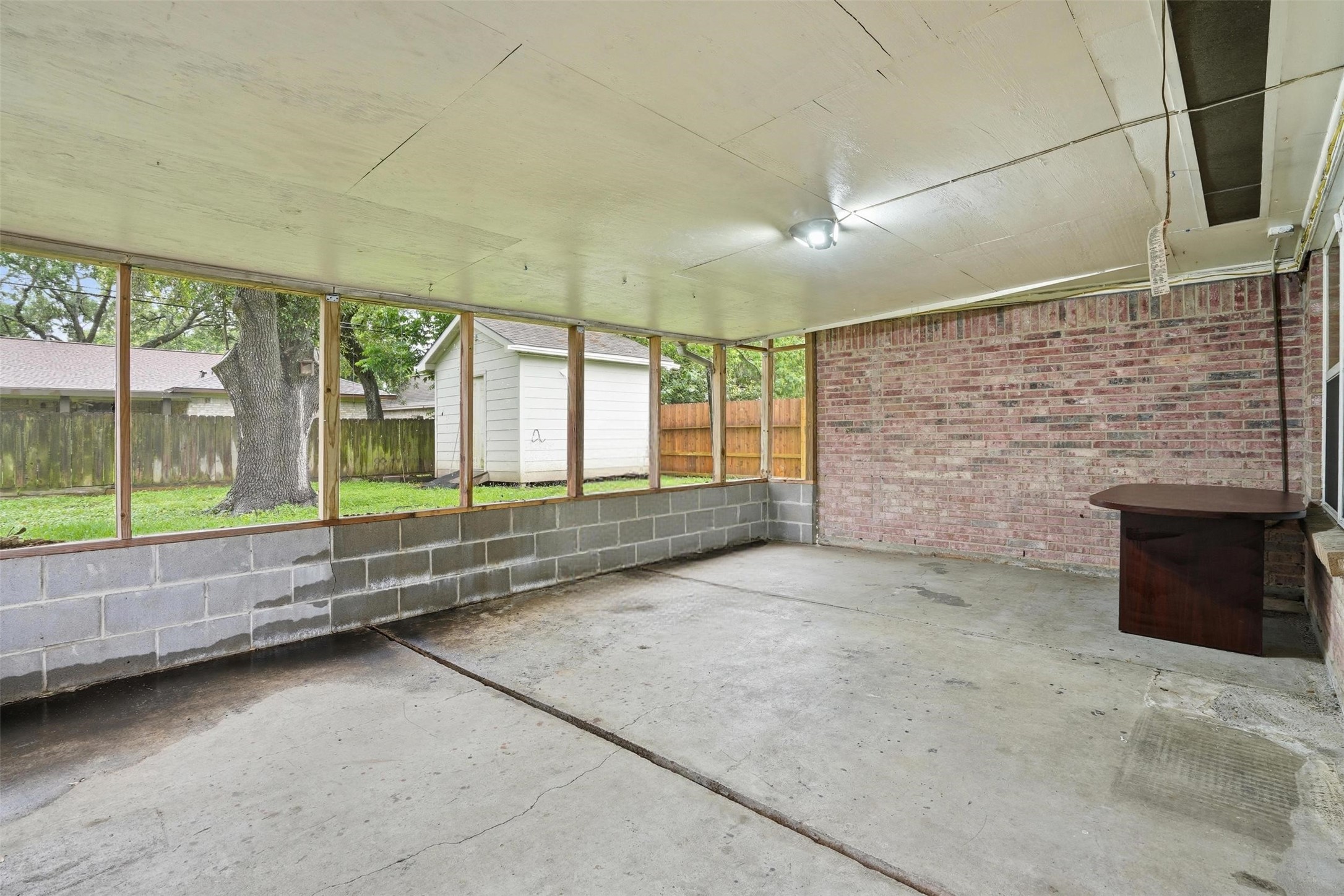 2605 Burke Road Pasadena, TX 77502 - Photo 25 of 29 a view of an empty room with a fireplace and a window