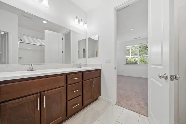 a utility room with sink dryer and washer