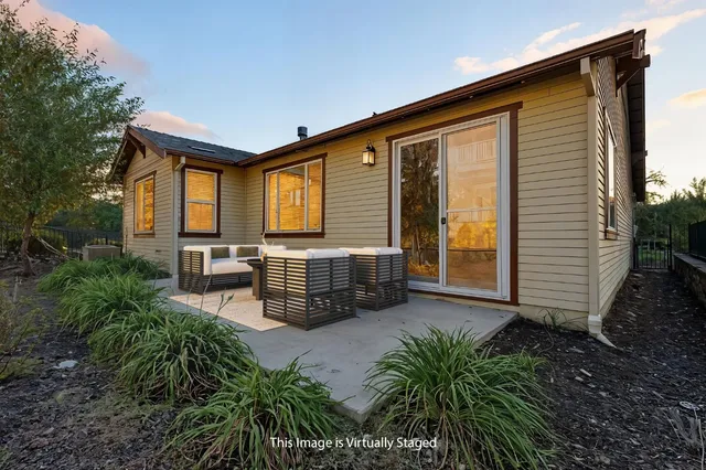 an aerial view of a house with a yard and garden