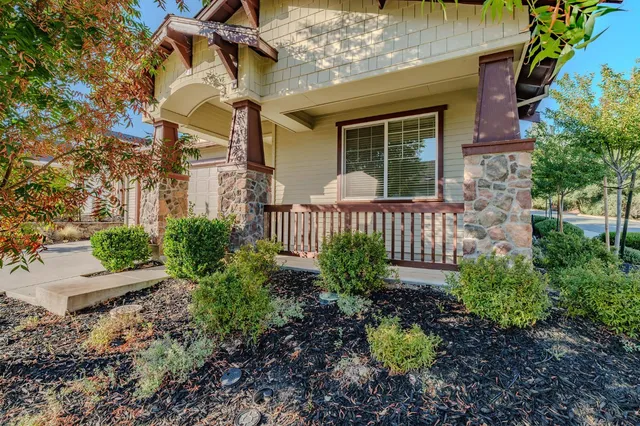 a view of a hallway with wooden floor and closet