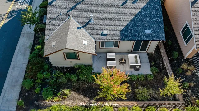 a wooden bench sitting in front of a building