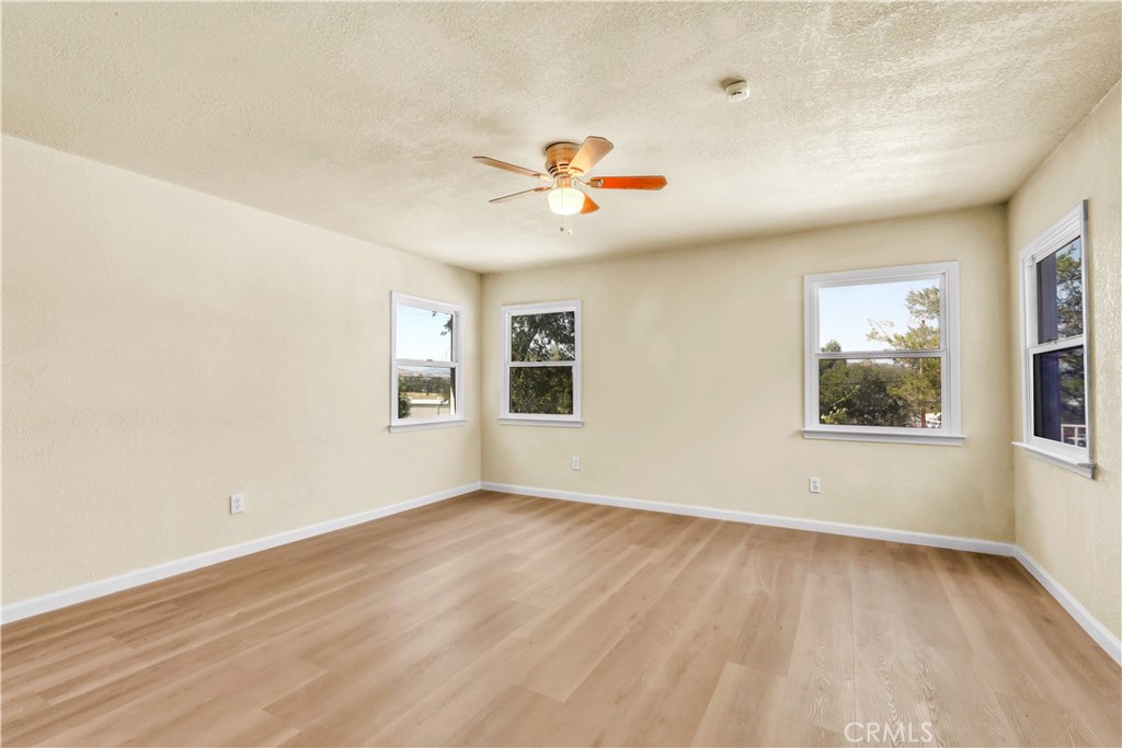15905 Kugelman Street Lower Lake, CA 95457 - Photo 48 of 75 wooden floor in an empty room with a window