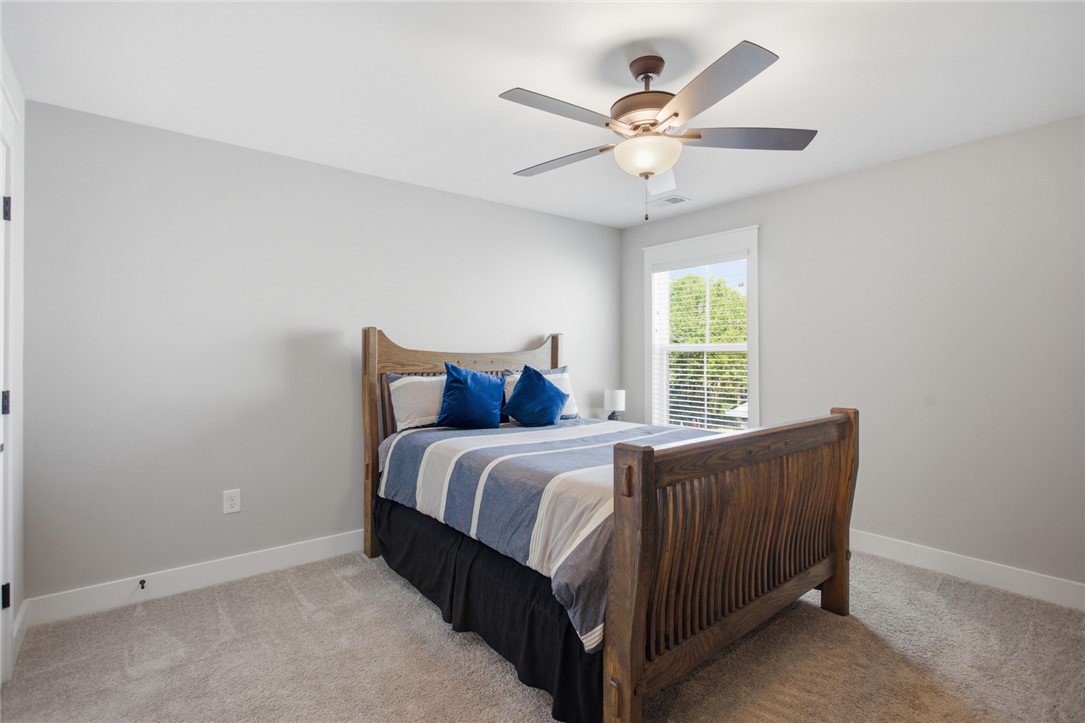 318 Summerall Drive Anderson, SC 29621 - Photo 23 of 42 This inviting bedroom features soft carpeting and a window offering natural light.