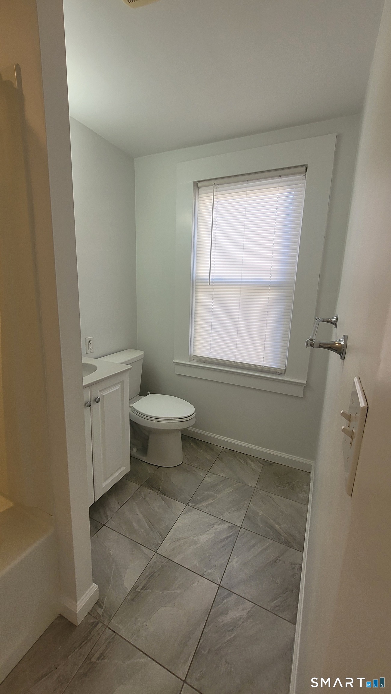 10 Olmstead Place Norwalk, CT 06855 - Photo 13 of 18 a bathroom with a sink a toilet and a bathtub