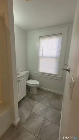a bathroom with a sink a toilet and a bathtub