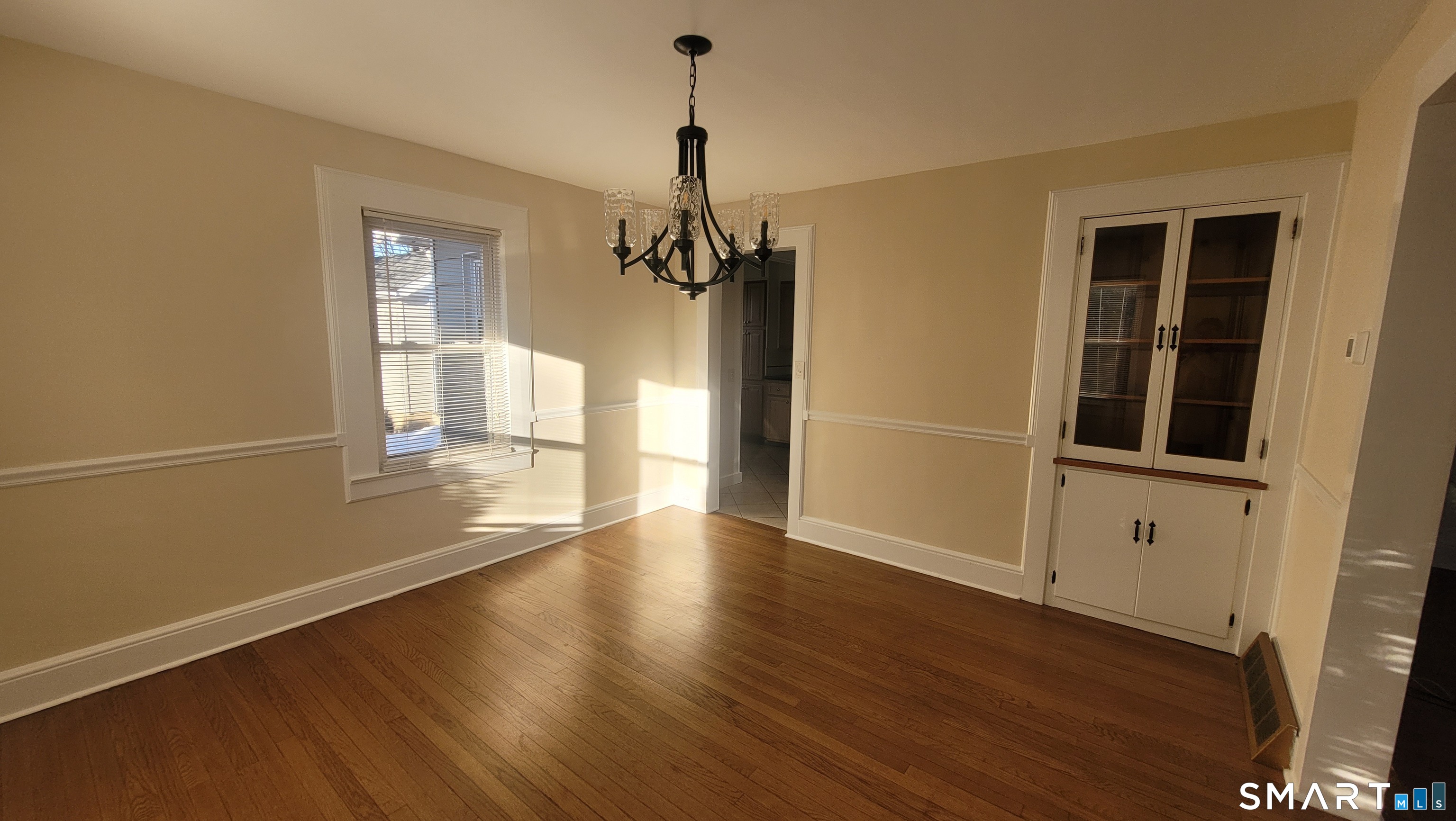 10 Olmstead Place Norwalk, CT 06855 - Photo 7 of 18 a view of a room with wooden floor and windows