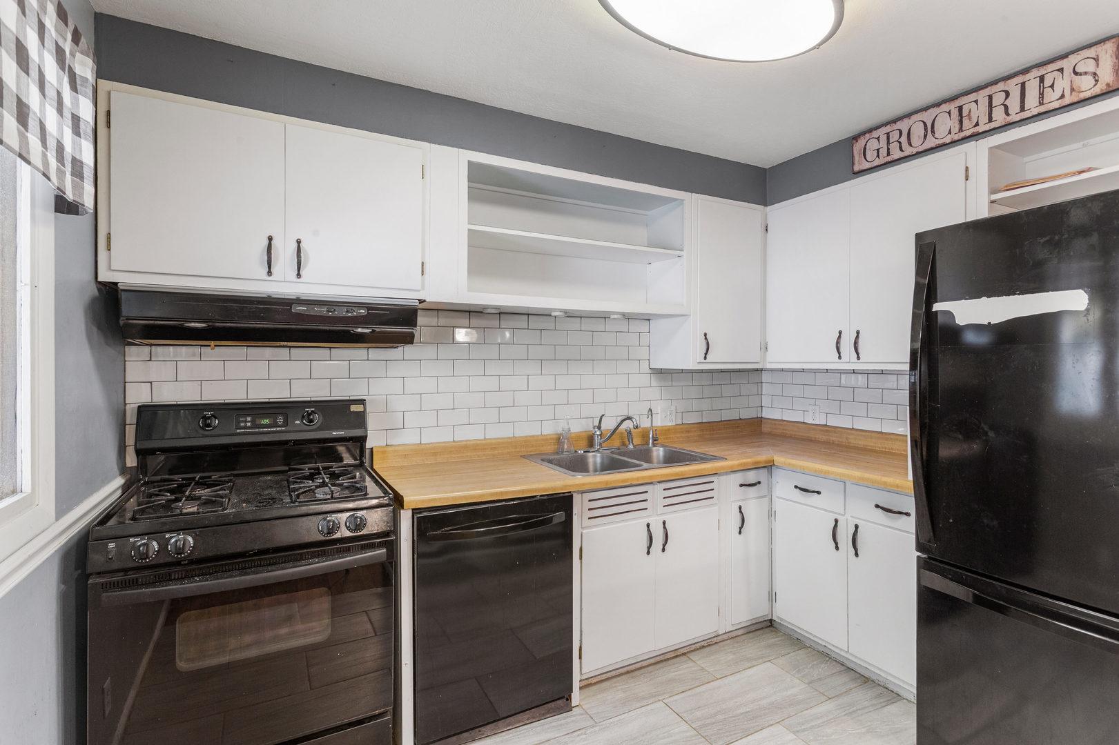 1420 South Western Avenue Champaign, IL 61821 - Photo 18 of 31 a kitchen with a stove and a refrigerator