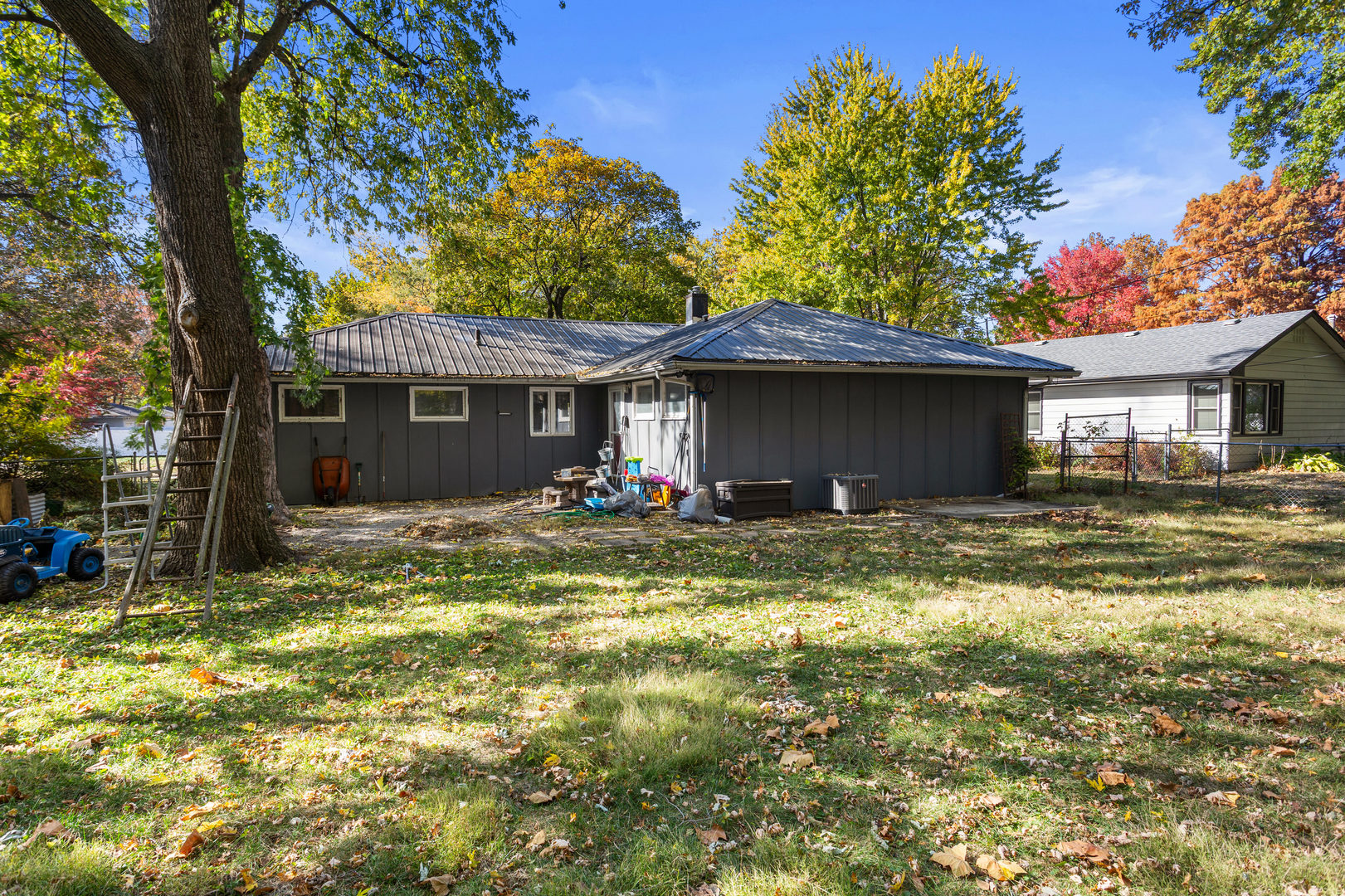 1420 South Western Avenue Champaign, IL 61821 - Photo 30 of 31 a view of a house with pool and chairs next to a yard