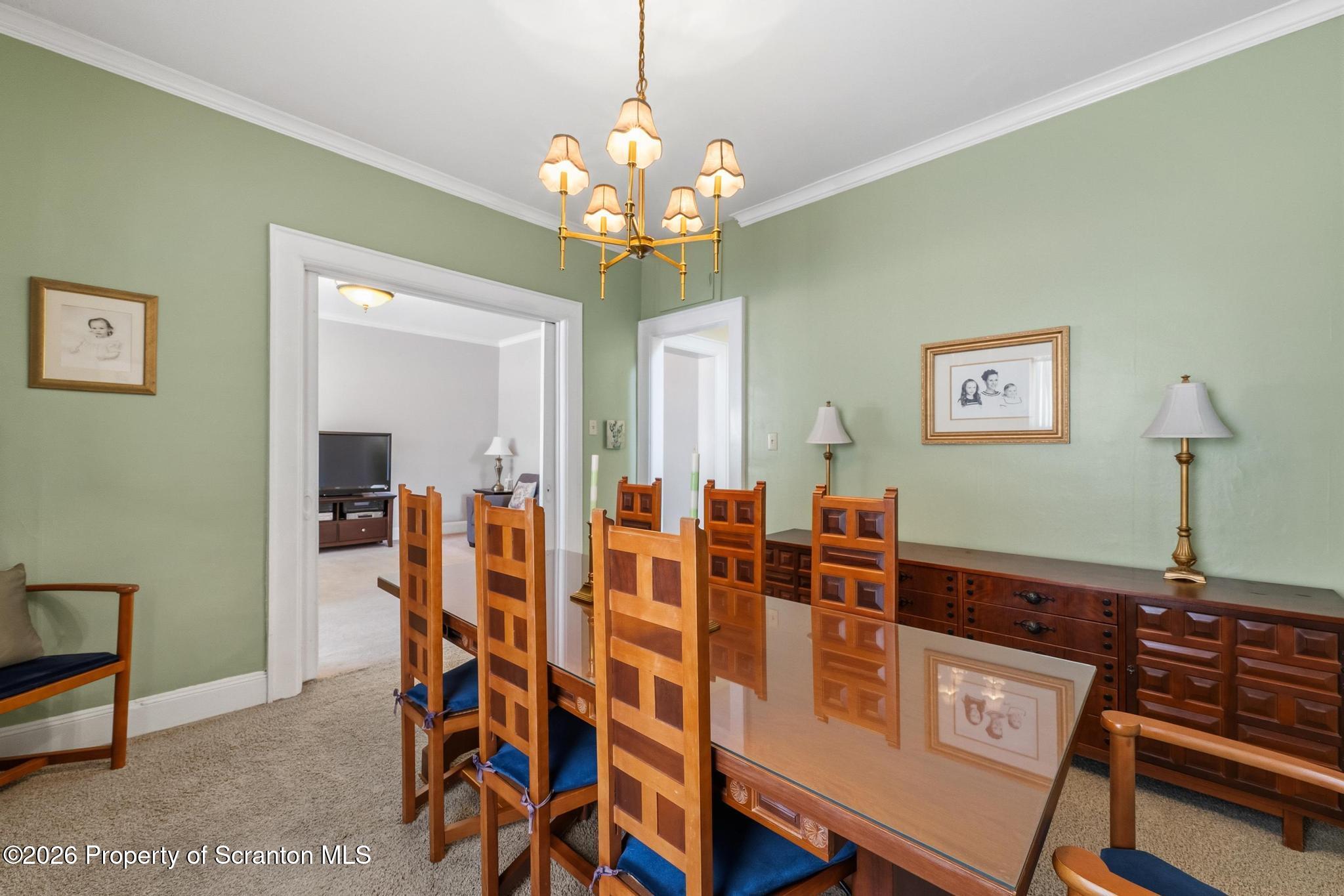 616 Myrtle Street Scranton, PA 18510 - Photo 12 of 65 a dining room with furniture and chandelier