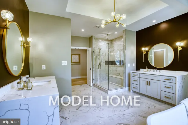 a large white kitchen with a large window and stainless steel appliances