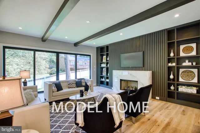 a living room with fireplace furniture and a flat screen tv