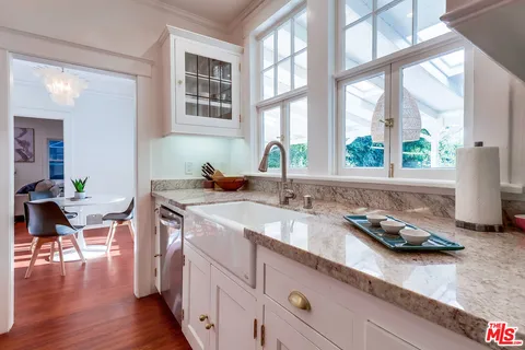 a view of a dining room with furniture wooden floor and a window