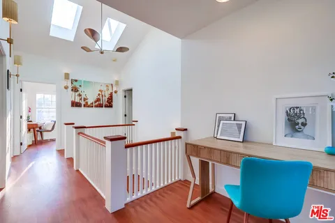 a bathroom with a double vanity sink mirror and shower
