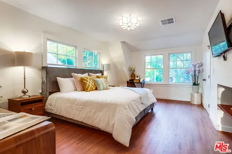 a bathroom with a shower sink and mirror