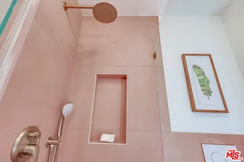 a view of a patio with a dining table and chairs with wooden floor
