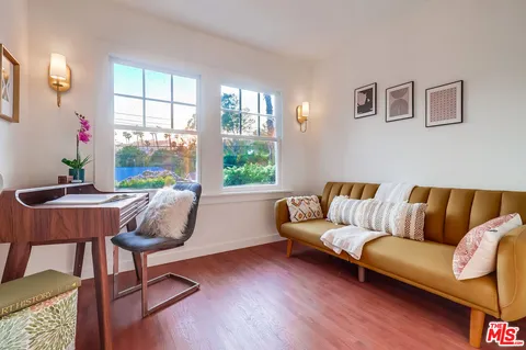 a view of a patio with a table and chairs