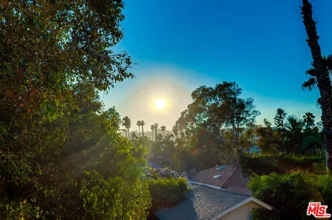a front view of a house with a yard table and chairs