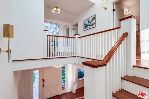 a front view of a house with a yard table and chairs