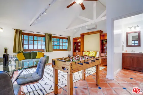 a bathroom with a shower a sink and a mirror