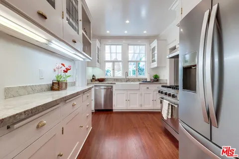 a kitchen with a sink and a window