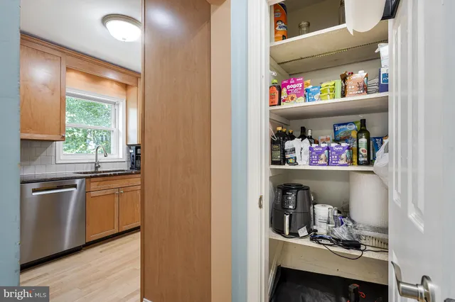 a kitchen with a refrigerator and a window