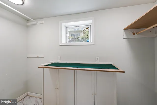 a bathroom with a toilet and a bathtub