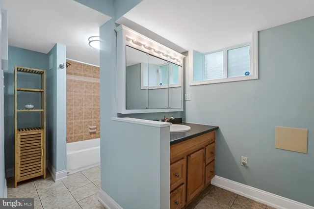a bathroom with a toilet and a bathtub
